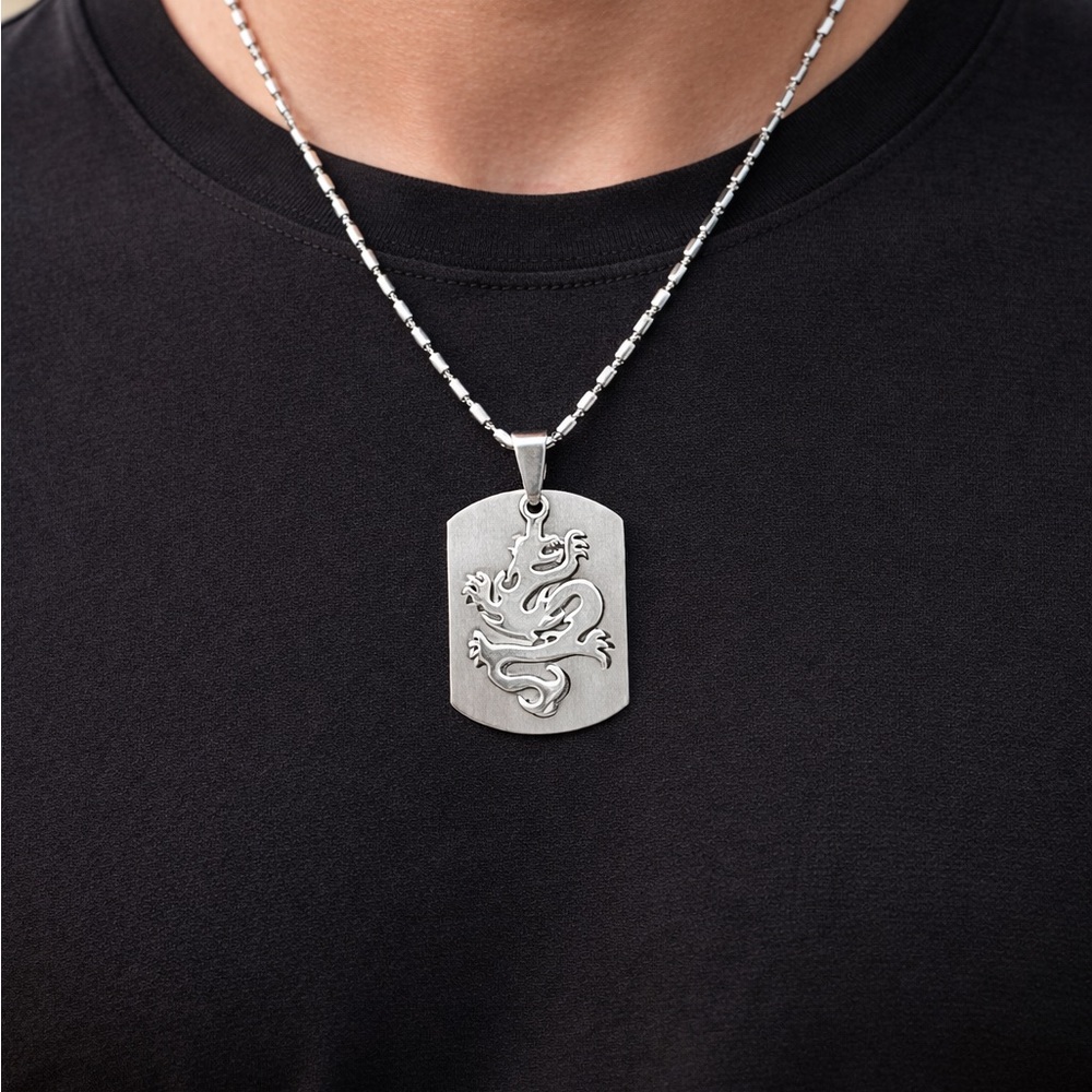 94. “Dragon Stainless Steel” silver necklace included.